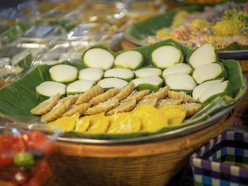 Close-up of fruits in basket at market stall