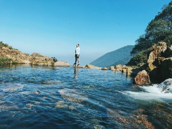 Scenic view of sea against clear blue sky