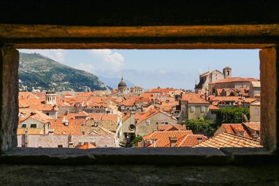 Buildings in town seen through window