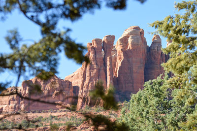 Low angle view of rock formation against sky