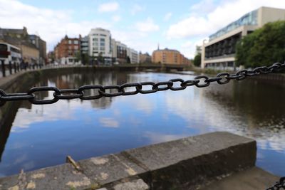 Chain link fence along river bank