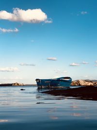 Boat in sea against sky