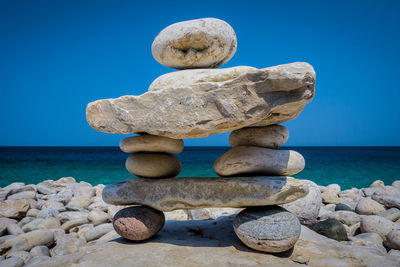 Stacked rocks against sea