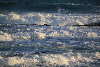 Waves splashing on rocks