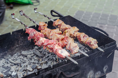 Cooking kebabs on fire up close. appetizing kebabs. meat on skewer. barbecue with charcoal.