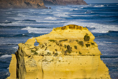 Scenic view of rock formation at beach during winter