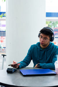 Young businesswoman working at desk in office