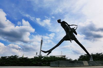 Low angle view of statue against sky