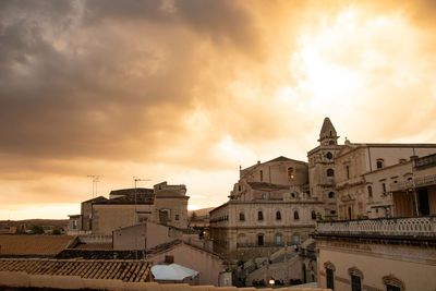 Buildings in city against sky