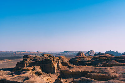 Scenic view of landscape against clear blue sky