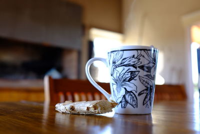Close-up of coffee cup on table