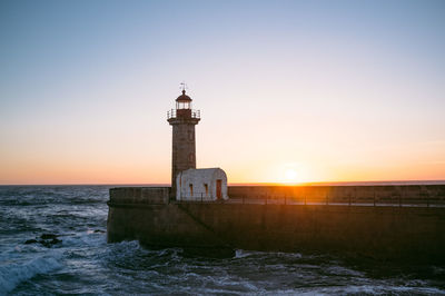 Scenic view of lighthouse on pier