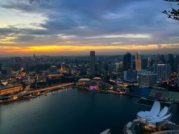 High angle view of marina bay and cityscape at dusk