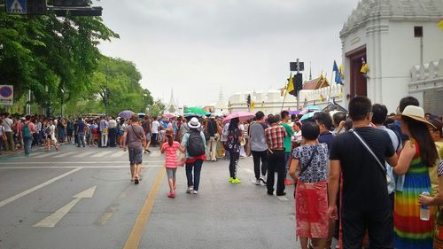 People walking on road in city