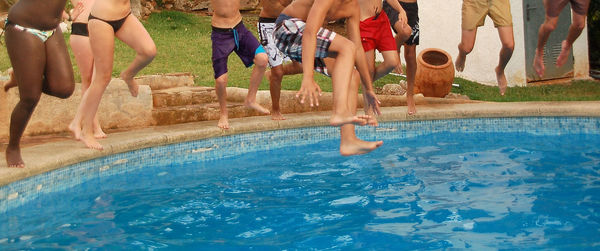 Low section of people in swimming pool