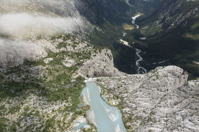 Low section of man standing on mountain