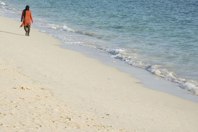 People walking on beach