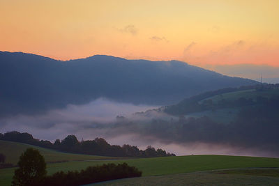 Scenic view of mountains against sky during sunset