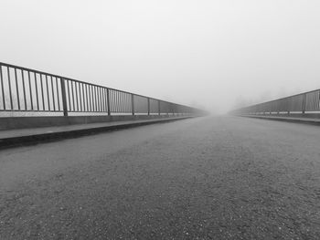 Bridge over road against sky