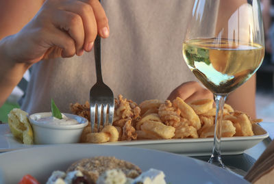 Midsection of man preparing food