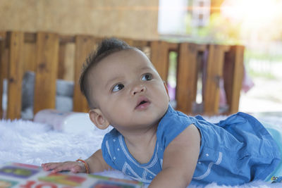 Portrait of cute boy looking at table