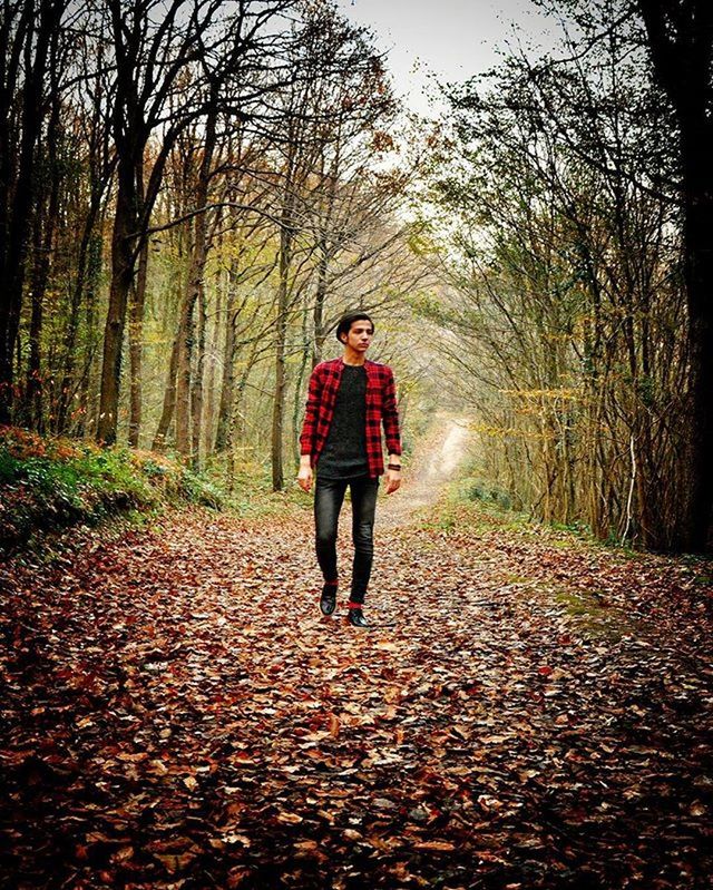 full length, lifestyles, casual clothing, leisure activity, tree, looking at camera, person, rear view, standing, front view, portrait, walking, the way forward, forest, young adult, childhood, elementary age, nature