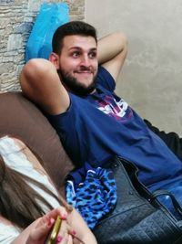 Portrait of young man sitting outdoors