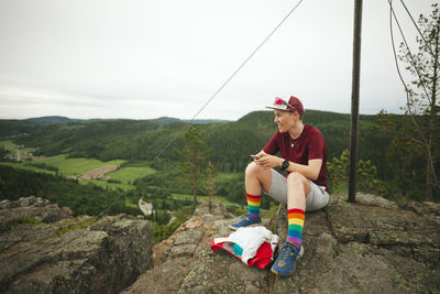 Hiker resting on rock