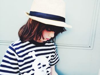 Portrait of woman wearing hat at home