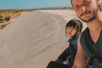 Full length of father and daughter on beach