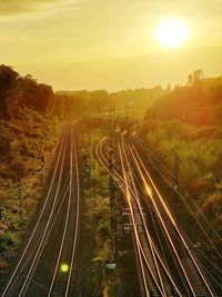 High angle view of railroad tracks against sky during sunset