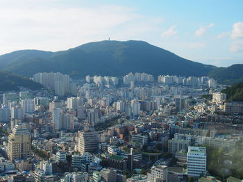 High angle view of buildings in city against sky