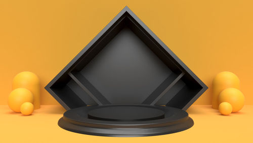 Close-up of yellow bell against orange background