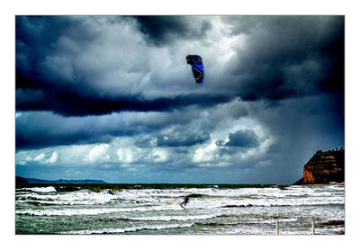 Scenic view of sea against cloudy sky