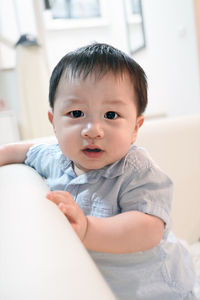 Portrait of cute baby at home