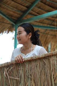 Portrait of young woman looking away