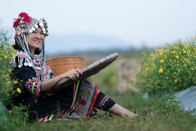 Woman sitting on field