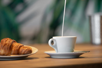 Coffee cup on table