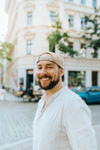 Portrait of smiling man in city