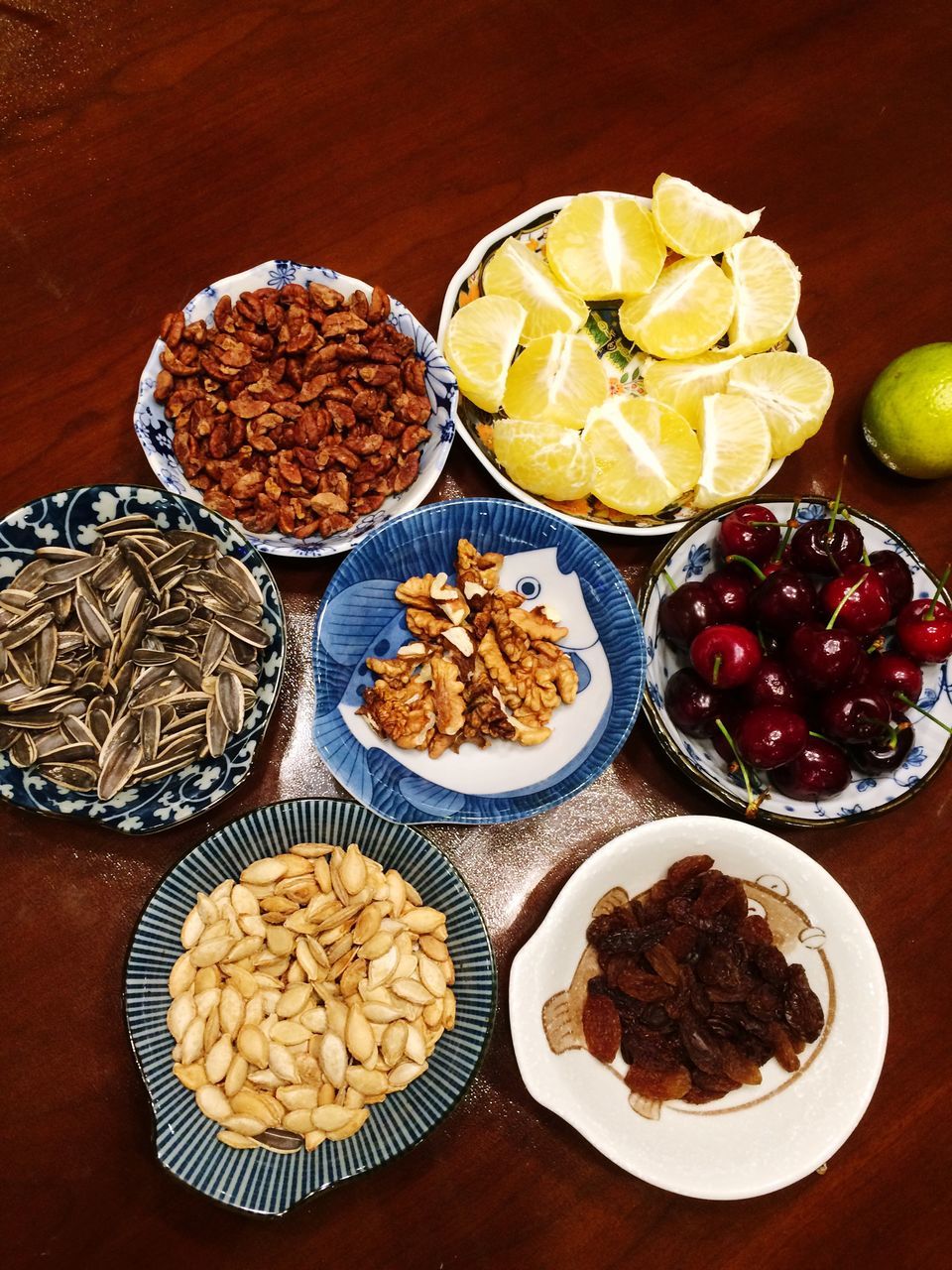 food and drink, food, indoors, freshness, ready-to-eat, plate, still life, table, healthy eating, fruit, indulgence, high angle view, serving size, sweet food, directly above, meal, variation, bowl, temptation, slice