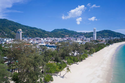 Scenic view of sea and buildings against sky