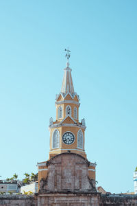 Low angle view of a building against clear blue sky