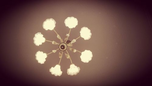 Low angle view of illuminated chandelier