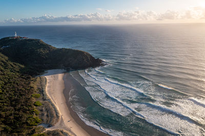 Byron bay australia. scenic view ocean beach patterned waves with white foam. travel and recreation