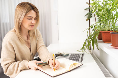 Portrait of young businesswoman working at office