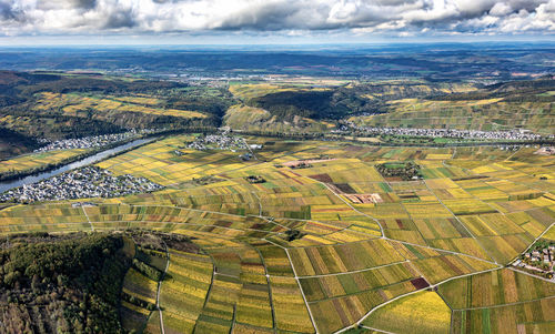 Aerial view of agricultural field against sky