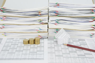 Close-up of craft and coins on table