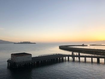 Scenic view of sea against clear sky during sunset