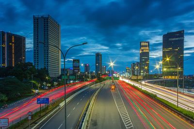 High angle view of light trails on road at dusk