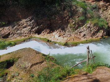 Scenic view of river flowing through rocks